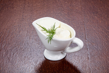 Cream sauce with herbs in the bowl