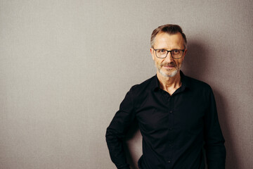 Fototapeta premium Earnest man wearing glasses looking at camera with serious look