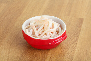 Marinated squid strips in the bowl
