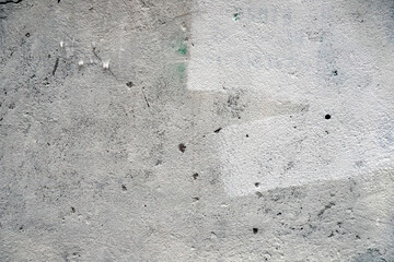 Concrete wall with traces of white putty background