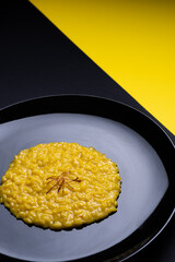 saffron risotto on dark background