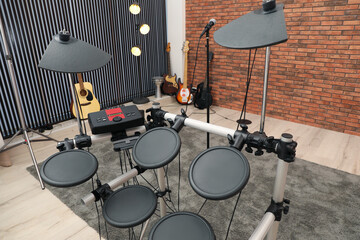 Fototapeta na wymiar Modern music studio with microphone and different electronic instruments