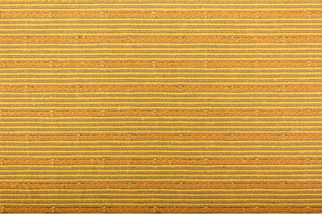 Obraz premium Background from a striped fabric beige. Abstract empty beige striped background, fabric texture, yellow knitted cloth, cotton, wool. Grunge rough. Seamless pattern