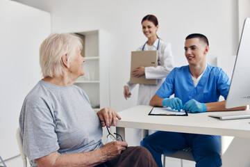 Fototapeta premium elderly woman communication with a doctor checkup