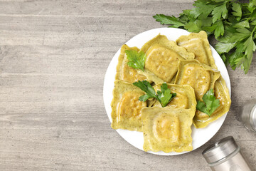 Delicious food concept with ravioli on textured background