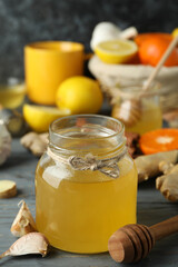 Concept of treatment colds with honey and garlic, close up