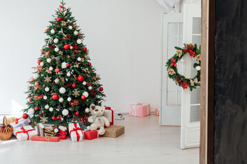 lights garland Christmas tree with gifts New Year 2022