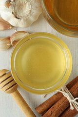 Concept of treatment colds with honey and garlic, close up