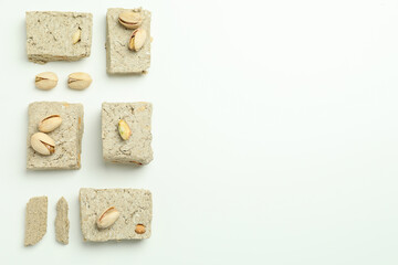 Flat lay with halva and pistachio on white background