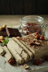 Concept of tasty food with halva on wooden table