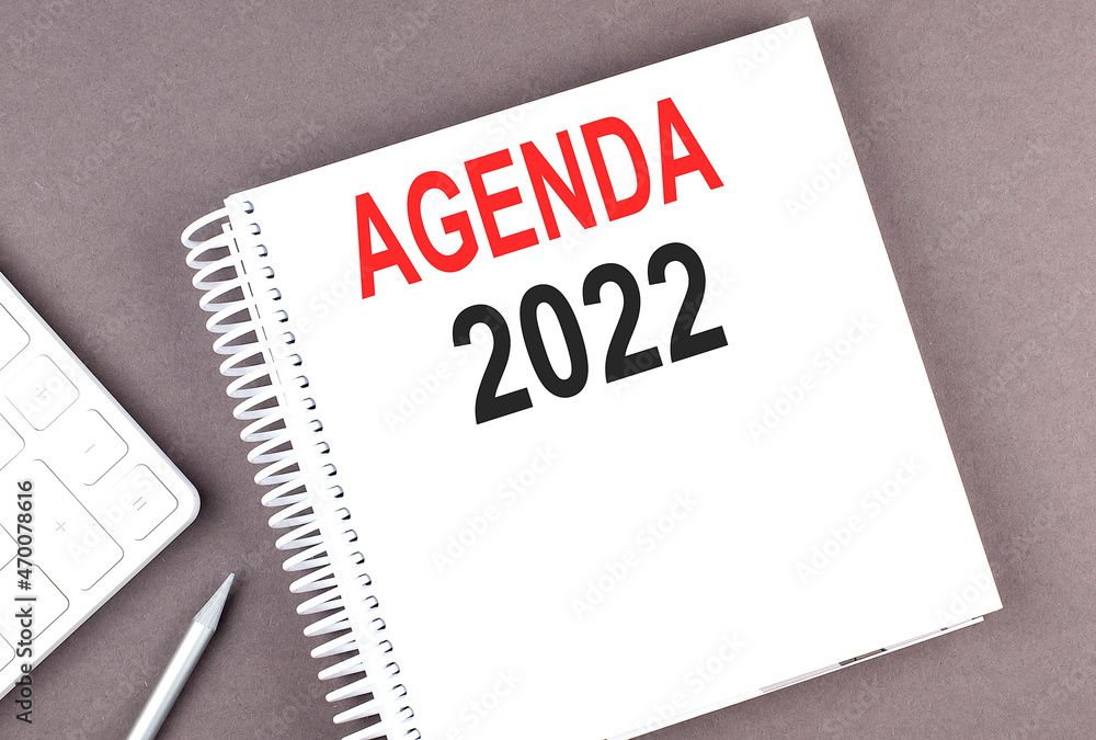 Poster agenda 2022 text on notebook with calculator and pen