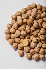 A handful of chickpeas close-up on a white background for cooking