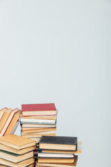 stacks of educational books in the college library on a white background