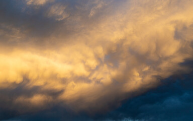Naklejka na ściany i meble Dramatic cloud formation at sunset time.