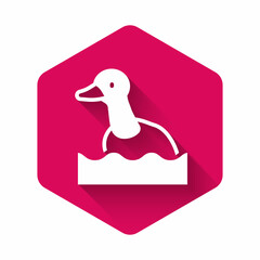 White Flying duck icon isolated with long shadow. Pink hexagon button. Vector