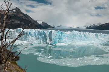 Ice chunks from the edge of Perito Moreno Glacier are calving into the lake