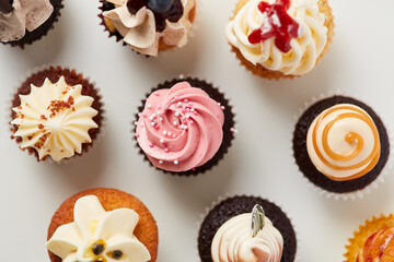 Lots of colorful little different cupcakes from above