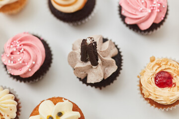 Small cupcakes with biscuit or decoration from above
