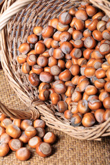 Hazelnuts in a wicker basket close-up