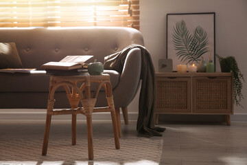 Stylish living room interior with stool and sofa