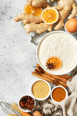 Ingredients for gingerbread cookies on a light gray culinary background. Assortment of food for Christmas or New Year's holiday baking top view