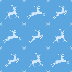 Christmas seamless pattern. White colored reindeer silhouettes on blue background with white snowflakes. Christmas texture