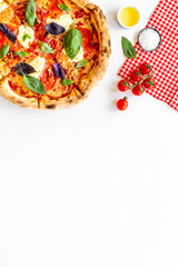 Food ingredients for cooking pizza - tomatoes cheese and basil