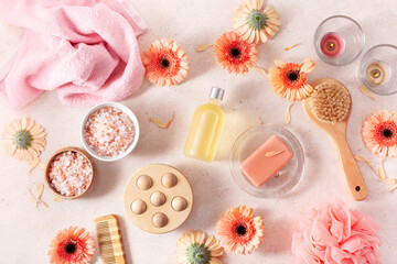 bath and body care products and daisy flowers. natural cosmetics for home spa treatment