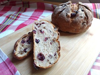 Crusty Bread mixed with dried cranberries. Bake the bread to be crispy on the outside, soft inside.