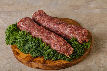 Raw minced beef kebab skewer