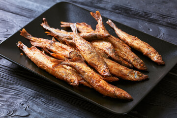crispy fried capelin, shishamo on a platter
