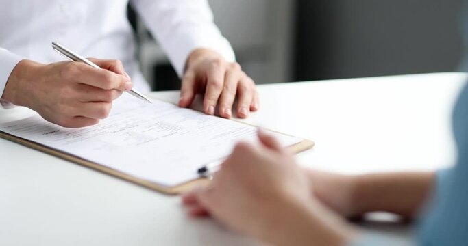 Doctor fills out patient medical record slow motion 4k movie