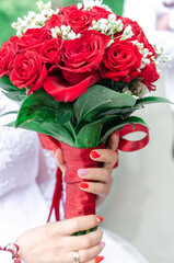 Bride holding a red wedding bouquet