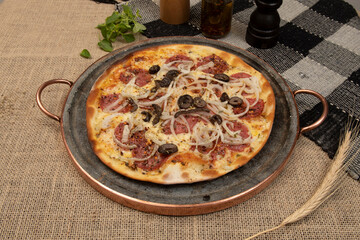 Brazilian pizza with pepperoni, cheese, onion and black olive