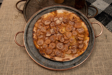 Sweet Brazilian pizza with banana, cinnamon and sugar