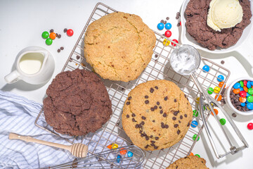 White and chocolate giant cookies. Very big cookies – chocolate, vanilla, chocolate chips, with ice cream ball. Trendy sweet baking.
