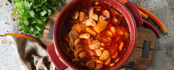 casserole of beans with chorizo on the table