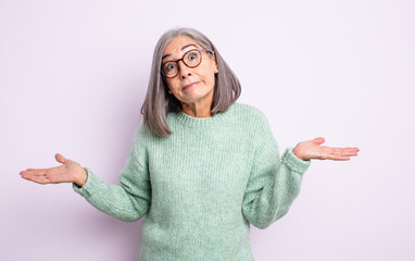 senior pretty woman feeling puzzled and confused, unsure about the correct answer or decision,...