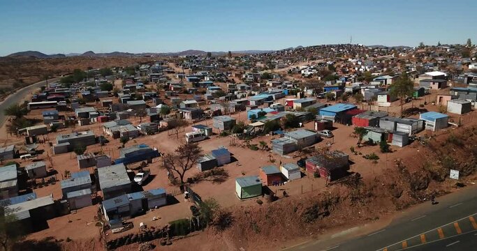 4K aerial drone video of Otjomuise slums poor township near Windhoek on hot sunny day in central Namibia, southern Africa