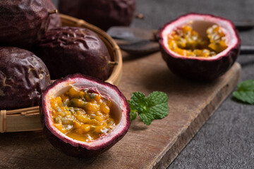 Delicious juicy passion fruit on gray table background.