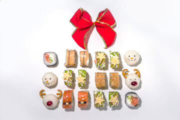 Fototapeta na wymiar Christmas sushi set with funny decorated rolls like Xmas symbols – santa, deer, snowman, fir tree, Christmas sushi bar menu, festive delivery mock-up