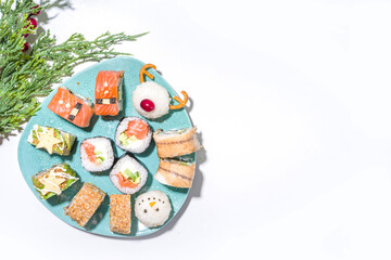 Christmas sushi set with funny decorated rolls like Xmas symbols – santa, deer, snowman, fir tree, Christmas sushi bar menu, festive delivery mock-up