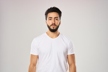 Cheerful man in a white t-shirt with an apple in the hands of health fruits