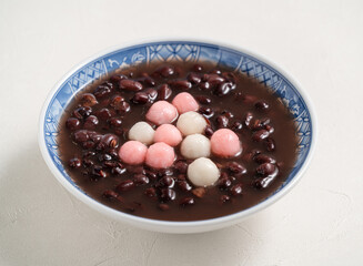 Red and white tangyuan with red bean soup.