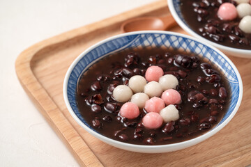 Red and white tangyuan with red bean soup.