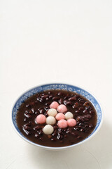 Red and white tangyuan with red bean soup.