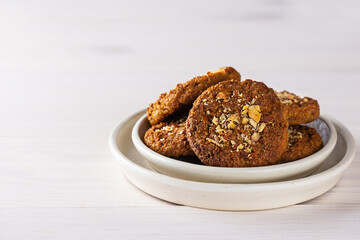 Homemade cookies with nuts on a light background. Sugar, gluten, lactose free, vegan.