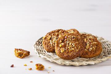 Homemade cookies with nuts on a wicker stand. Sugar, gluten, lactose free, vegan, healthy food.