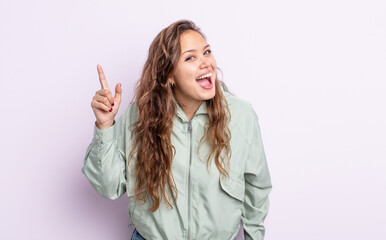 hispanic pretty woman feeling like a happy and excited genius after realizing an idea, cheerfully...