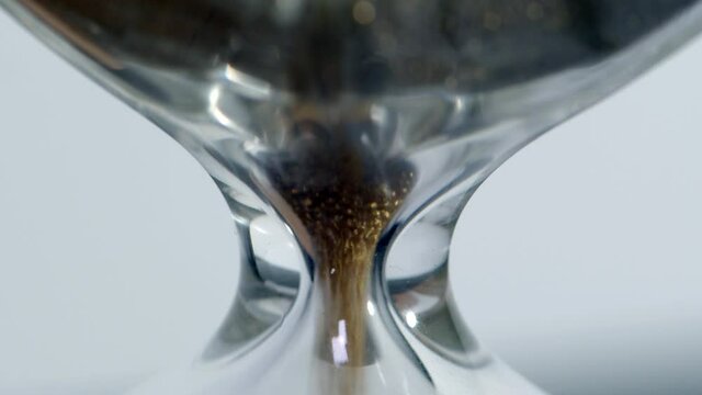 Close-up sand clock measuring time